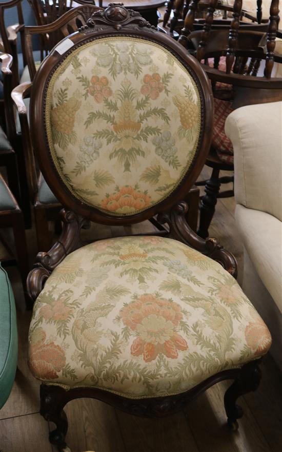 A Victorian walnut nursing chair